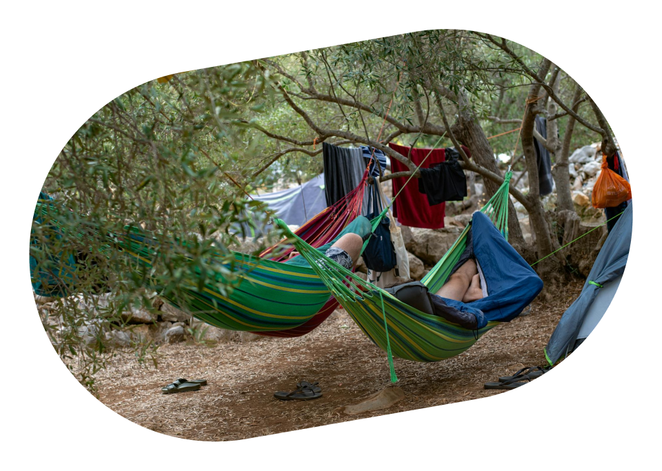 Illustrative image of people enjoying in front of a campervan, depicting outdoor leisure